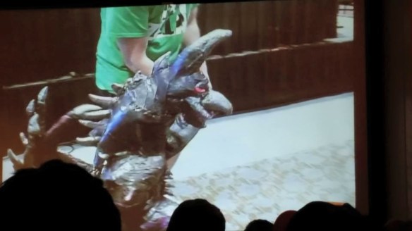 Why yes, that is a hilariously tiny girl dressed up as the cyborg death-metal outer space murder-chicken from Godzilla Final Wars. 