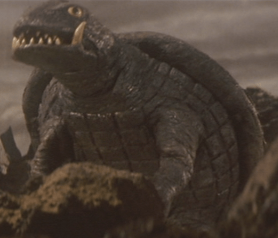 Gamera_-_5_-_vs_Jiger_-_15_-_Gamera_survived_the_flying_Jiger.png