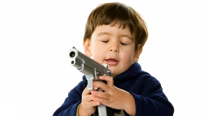 kid-playing-with-gun-1-592a2e05e042aa3e9c1fbf9fb62675f4.jpg